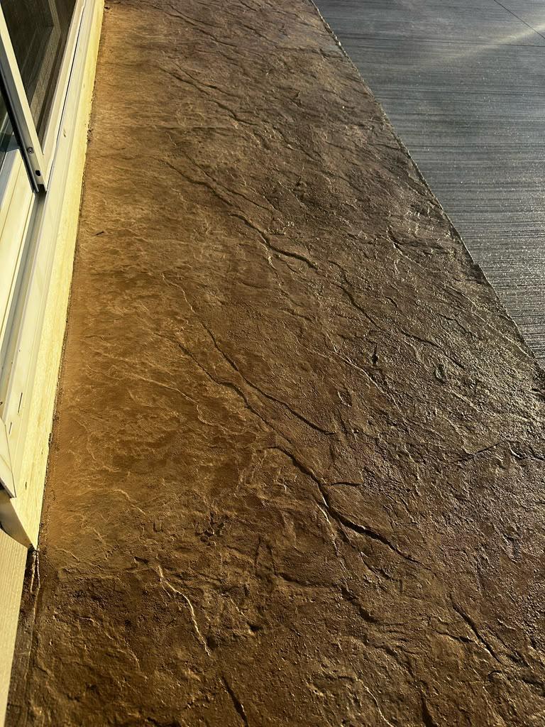 Seamless stone-textured stamped entry landing and steps